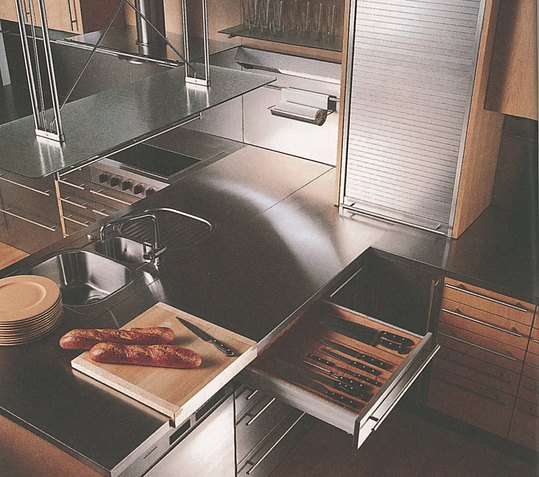 Functional equipment such as sliding doors and prisms in the drawers, which also serve as a design element
