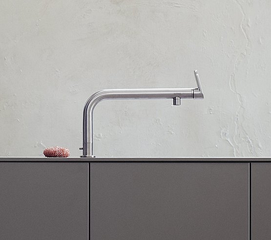 A single-lever faucet attached to the work surface