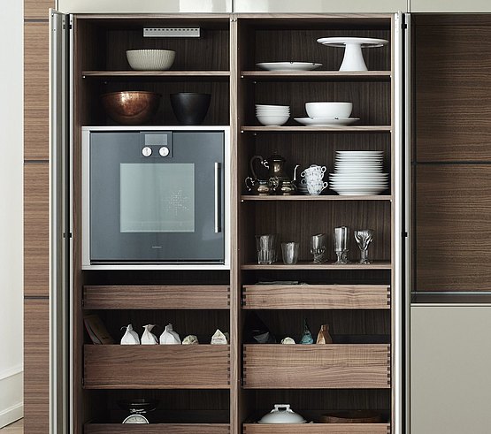 Sliding doors that pivot and glide sideways along the cabinet to keep the way clear