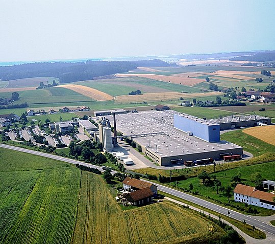 New company location viewed from the air: large production halls next to the office buildings